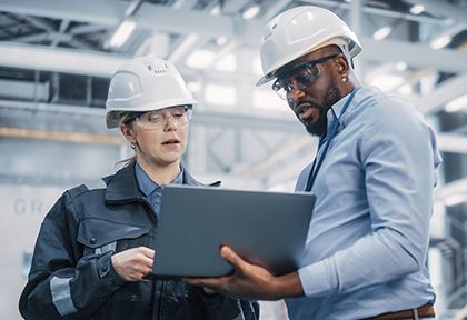 Two Engineers Looking at Laptop